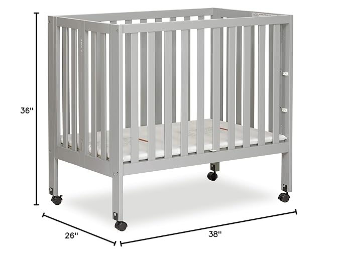 Dream On Me Jett Mini Folding Baby Crib in Pebble Grey, GreenGuard Gold & JPMA, Lightweight & Portable, Patented Flat Folding System, Small Spaces & Travel, 1.5” Mattress Pad, 3 Heights, Safe Wheels