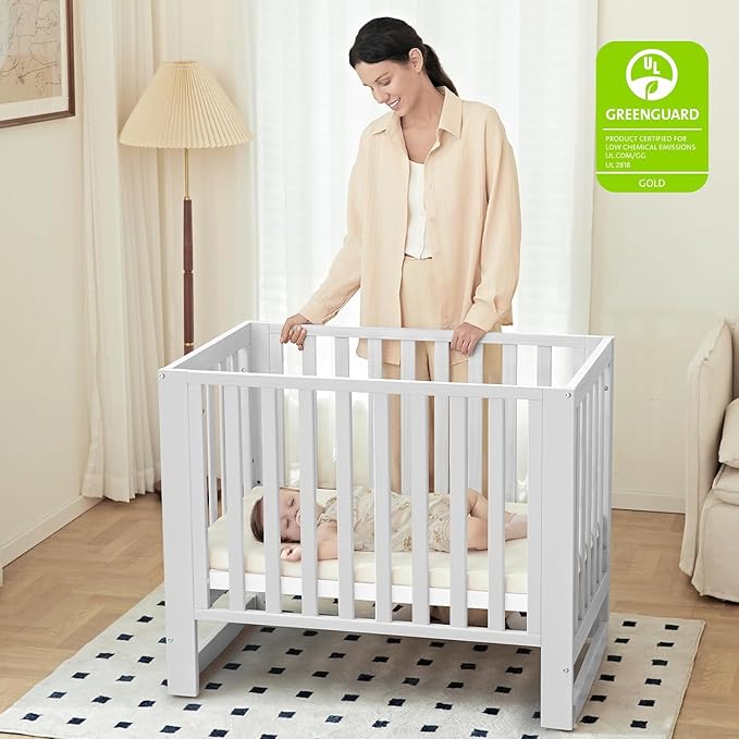 MAMAZING EvoNest Baby Crib, 6 in 1 Convertible Mini Crib with Wheels, 100% New Zealand Wood Growing Bed, 4 Adjustable Mattress Height, GREENGUARD Gold Certified, White