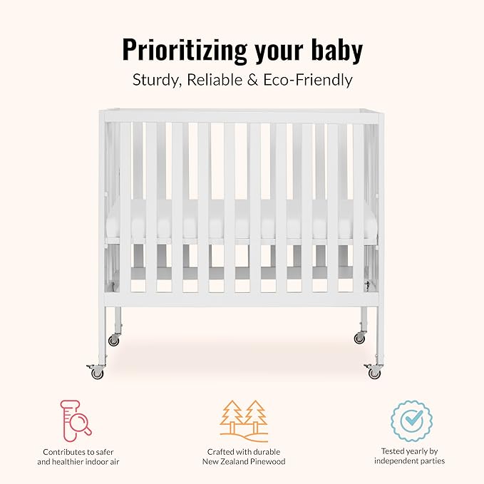 Dream On Me Jett Mini Folding Baby Crib in White, GreenGuard Gold & JPMA, Lightweight & Portable, Patented Flat Folding System for Small Spaces & Travel, 1.5” Mattress Pad, 3 Heights, Safe Wheels