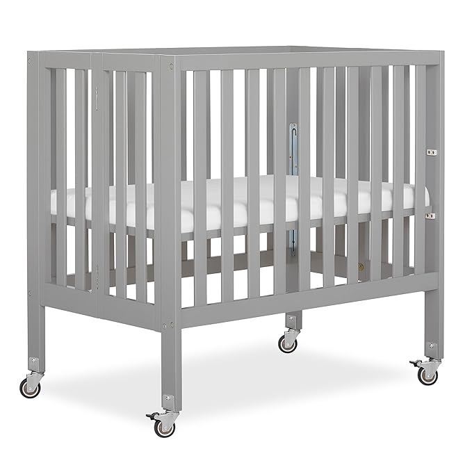 Dream On Me Jett Mini Folding Baby Crib in Pebble Grey, GreenGuard Gold & JPMA, Lightweight & Portable, Patented Flat Folding System, Small Spaces & Travel, 1.5” Mattress Pad, 3 Heights, Safe Wheels