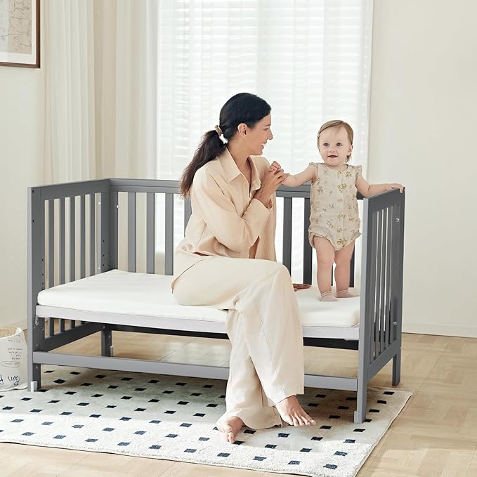 MAMAZING EvoNest Baby Crib, 6 in 1 Convertible Mini Crib with Wheels, 100% New Zealand Wood Growing Bed, 4 Adjustable Mattress Height, GREENGUARD Gold Certified, Grey