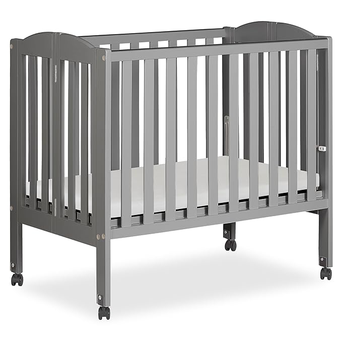 Dream On Me 2-in-1 Folding Portable Compact Mini Baby Crib in Steel Grey, GreenGuard Gold & JPMA, US Patented Flat Folding System, Locking Wheels, 1″ Mattress Pad, Space-Saving Quck Fold Easy Storage