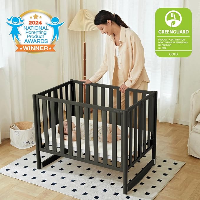 MAMAZING EvoNook 6-in-1 Convertible Mini Crib, 100% New Zealand Pinewood, 4 Adjustable Mattress Heights,GREENGUARD Gold Certified, Black with Matttress
