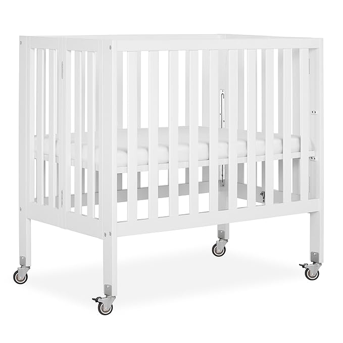 Dream On Me Jett Mini Folding Baby Crib in White, GreenGuard Gold & JPMA, Lightweight & Portable, Patented Flat Folding System for Small Spaces & Travel, 1.5” Mattress Pad, 3 Heights, Safe Wheels