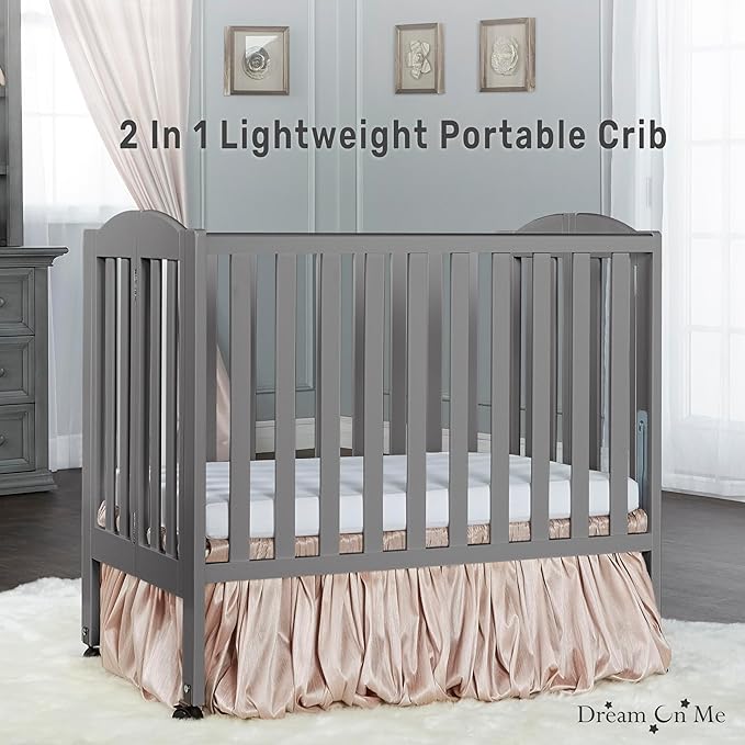 Dream On Me 2-in-1 Folding Portable Compact Mini Baby Crib in Steel Grey, GreenGuard Gold & JPMA, US Patented Flat Folding System, Locking Wheels, 1″ Mattress Pad, Space-Saving Quck Fold Easy Storage