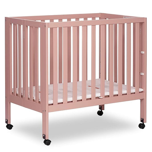 Dream On Me Jett Mini Folding Baby Crib in Dusty Pink, GreenGuard Gold & JPMA, Lightweight & Portable, Patented Flat Folding System for Small Spaces & Travel, 1.5” Mattress Pad, 3 Heights, Safe Wheels
