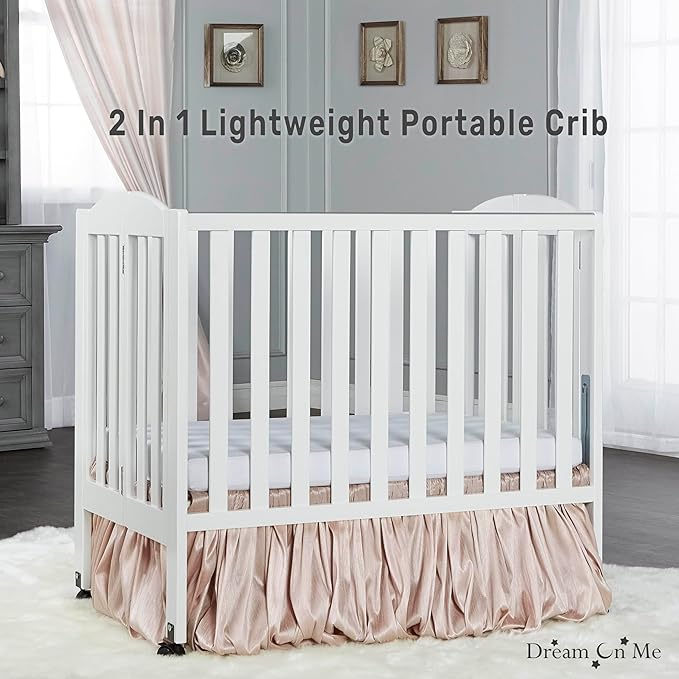 Dream On Me 2-in-1 Folding Portable Compact Mini Baby Crib in White, GreenGuard Gold & JPMA, US Patented Flat Folding System, Locking Wheels, 1″ Mattress Pad, Space-Saving Quck Fold Easy Storage