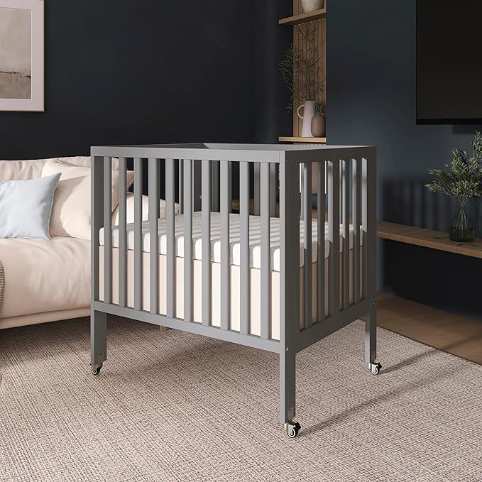 Dream On Me Jett Mini Folding Baby Crib in Pebble Grey, GreenGuard Gold & JPMA, Lightweight & Portable, Patented Flat Folding System, Small Spaces & Travel, 1.5” Mattress Pad, 3 Heights, Safe Wheels