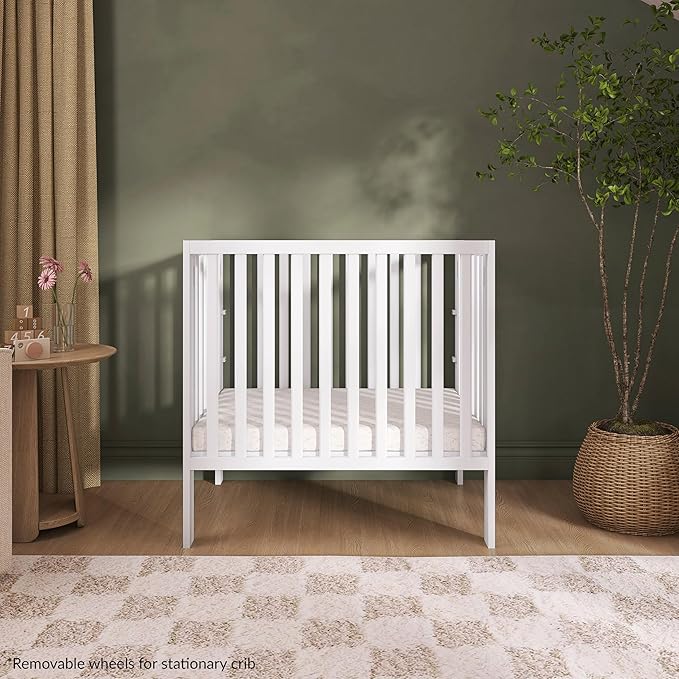 Dream On Me Jett Mini Folding Baby Crib in White, GreenGuard Gold & JPMA, Lightweight & Portable, Patented Flat Folding System for Small Spaces & Travel, 1.5” Mattress Pad, 3 Heights, Safe Wheels