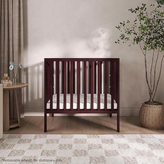 Dream On Me Jett Mini Folding Baby Crib in Espresso, GreenGuard Gold & JPMA, Lightweight & Portable, Patented Flat Folding System for Small Spaces & Travel, 1.5” Mattress Pad, 3 Heights, Safe Wheels